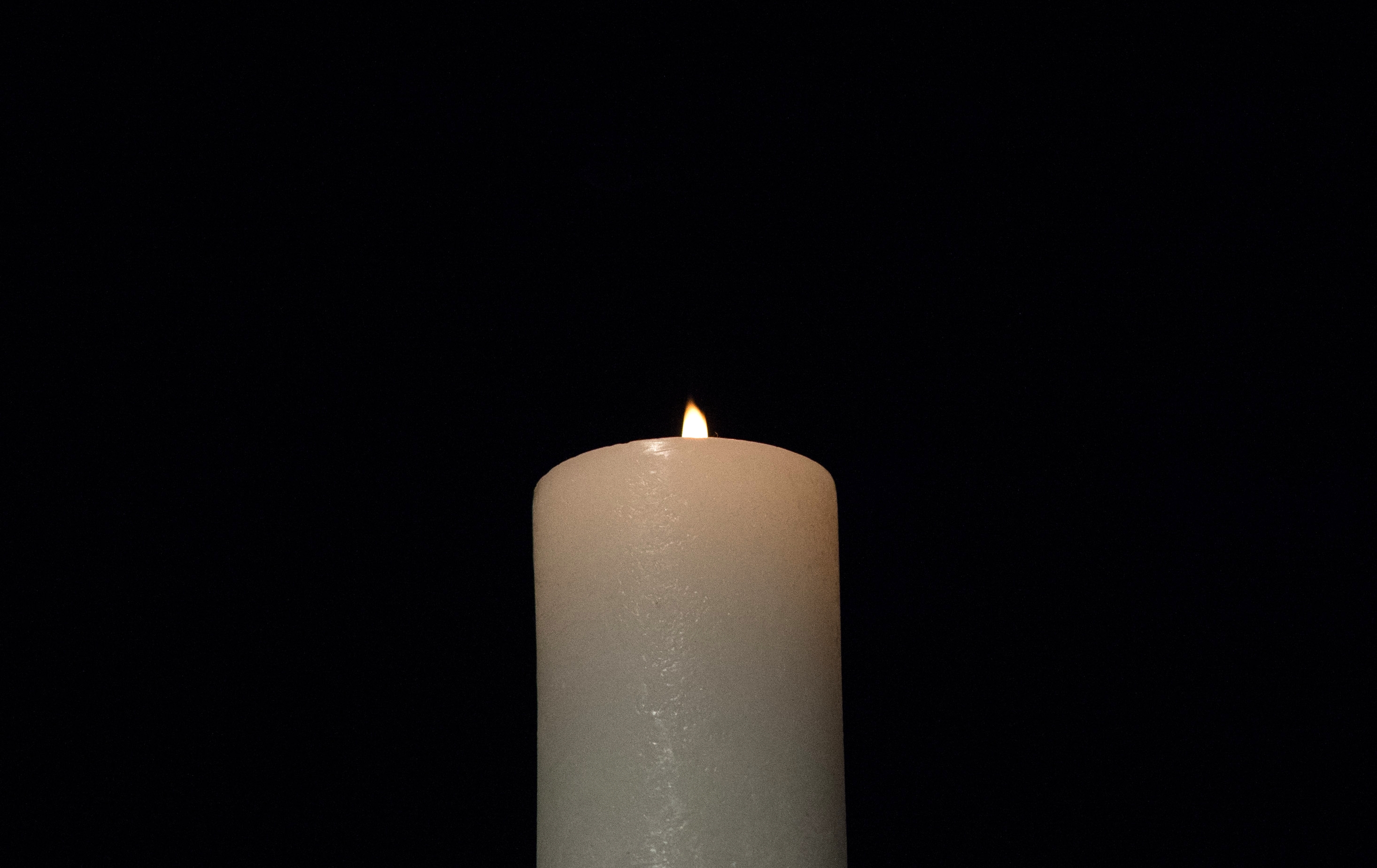 A_ceremonial_candle_was_lit_and_burns,_during_the_2013_Federal_Inter-Agency_Holocaust_Remembrance_Day,_at_the_Lincoln_Theater,_on_Wednesday,_April_17,_2013,_in_Washington,_D.C.